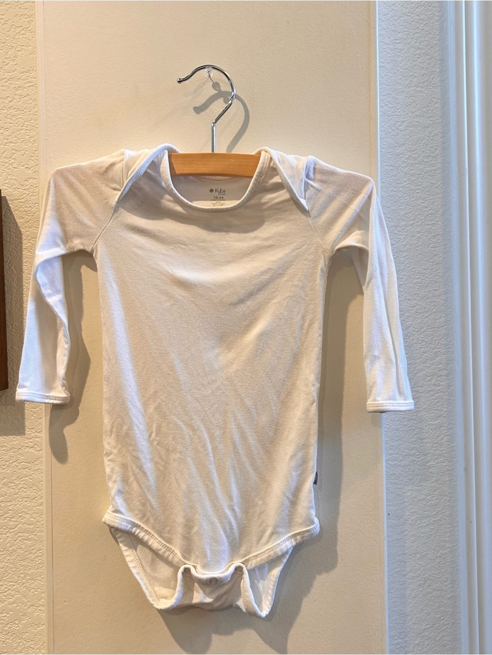 KYTE White Long-Sleeve Baby One-Piece Bodysuit